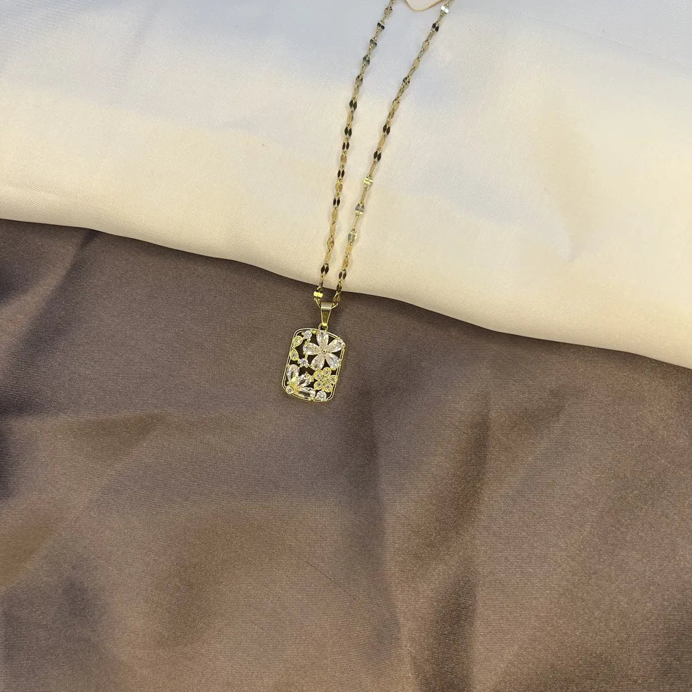 Gold-Tone Floral Pendant Necklace with Clear Crystal Accents