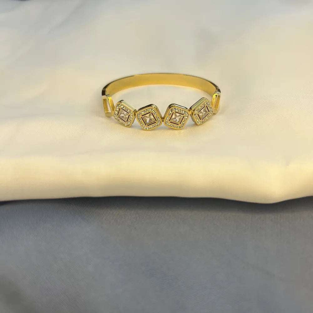 Gold-Tone Bangle Bracelet with Square Crystal Accents