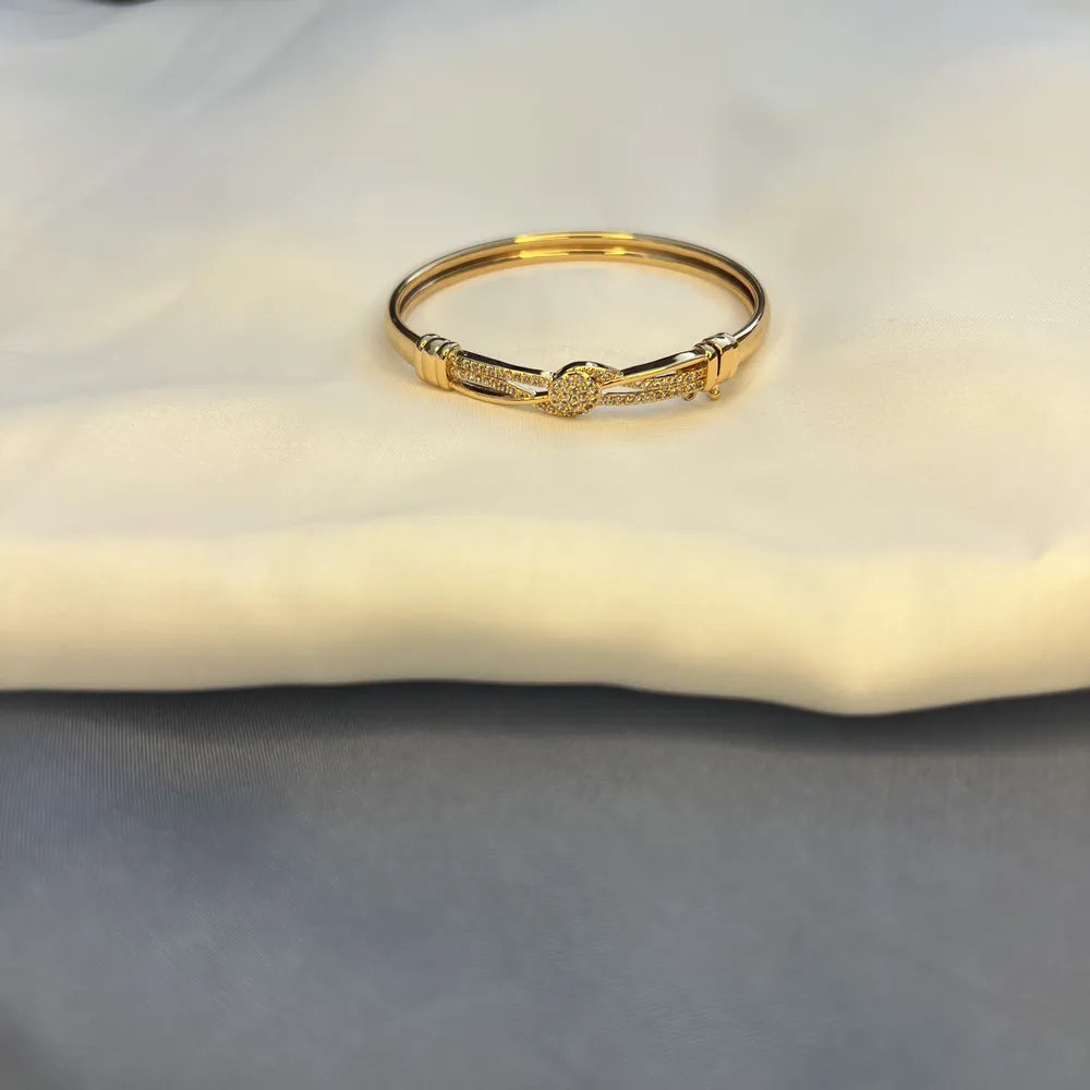 Gold-Tone Bangle Bracelet with Crystal-Studded Center
